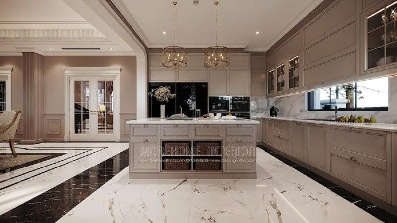 Bàn đảo bếp tân cổ điển ốp đá đẹp sang trọng với thiết kế nhiều hộc tủ cùng các ô mở giúp không gian trở nên linh động, tiện nghi.