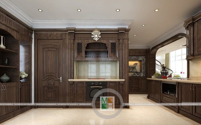Phòng bếp cư tân cổ điển được thiết kế với hệ tủ bếp gỗ tự nhiên nâu trầm, kiểu dáng tinh tế và nghệ thuật đẹp mắt, tạo nên vẻ đẹp sang trọng, đẳng cấp cho căn phòng.