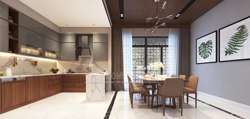 Tại biệt thự, nhà phố Vinh, Nghệ An, bố trí nội thất phòng bếp và phòng ăn sang trọng, độc đáo với nội thất gỗ chủ đạo bao gồm tủ bếp, bộ bàn ghế và tường ốp gỗ.
